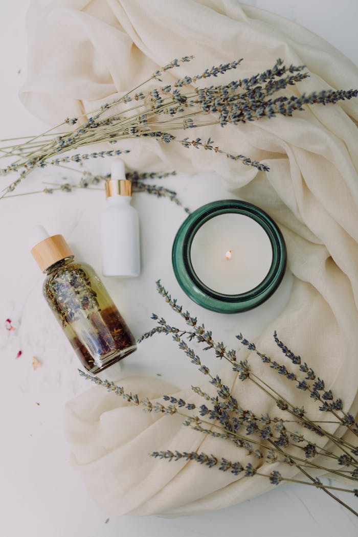 Services A calming flat lay of spa essentials featuring lavender and candles for relaxation.